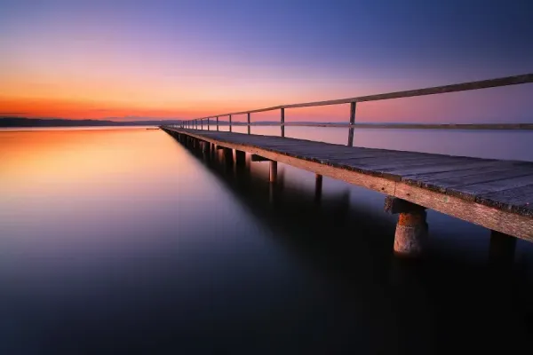 Sunset over Tuggerah Lake at Long Jetty, home to the Central Coast's best cafe strip